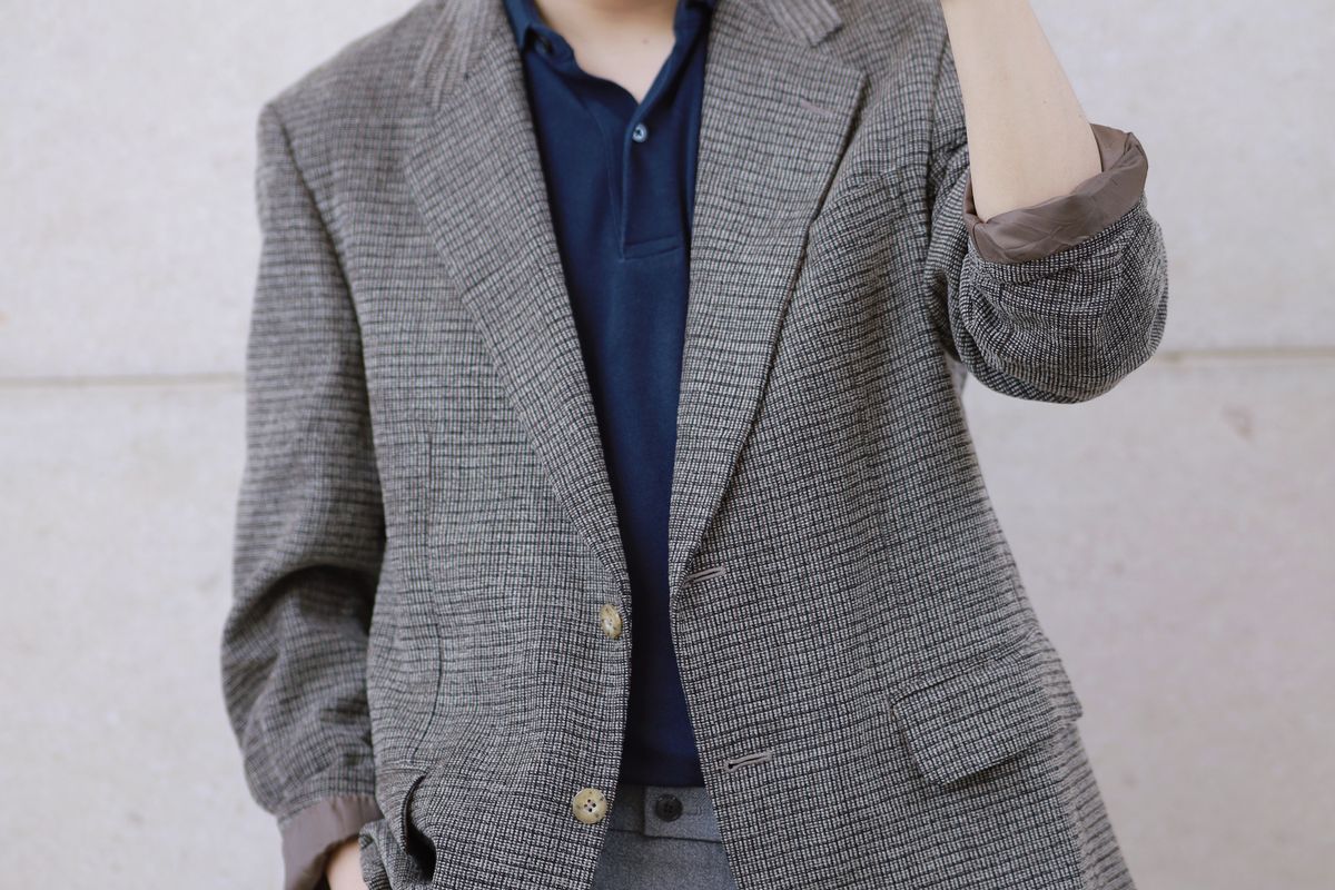 tailored blazer jacket on a wooden hanger