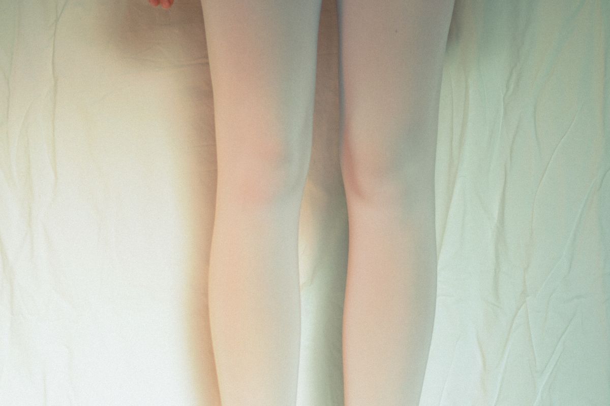 white leggings and socks folded flat lay